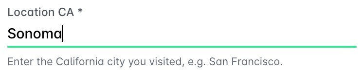 A text field for a location with a hint below it.