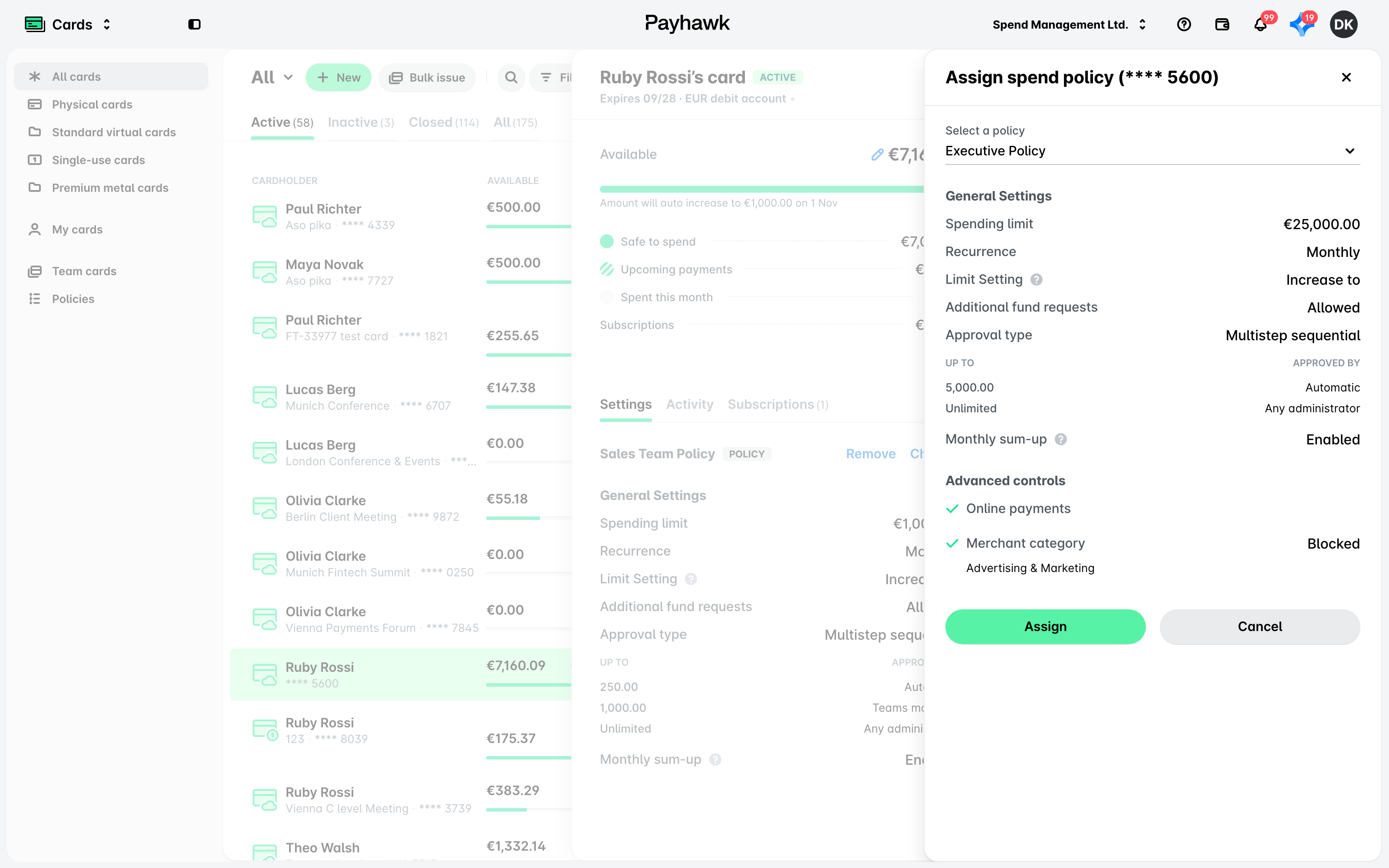 The Assign spend policy panel opened with Change on a card that already has a spend policy, with a new policy selected.
